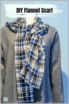 Blue, black, gray and white plaid flannel scarf wrapped around a mannequin.