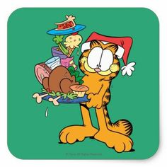 garfield the cat holding a plate with food on it and wearing a santa claus hat