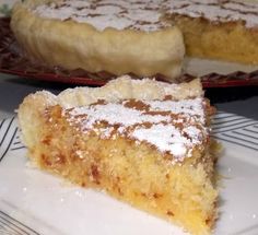 a piece of cake sitting on top of a white plate next to a slice of pie