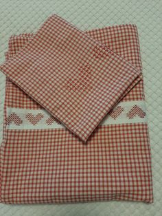 two red and white checkered cloths on top of each other