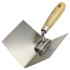 a metal trowel with a wooden handle