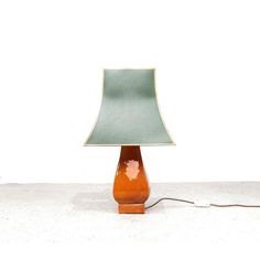 Rare set of 2 large italian mid-century modern table lamps produced by zaccagnini ceramiche italy, 1950s.  the lamps have an earthenware base glazed in beautiful warm ocher.  the large green shade has a golden inside, which gives a nice warm glow when the lamps are on.  the lamps are real eye-catchers and look beautiful in a classic, vintage as well as a modern interior.  each lamp has 2 x e24 fittings, can also be used with led lamps. The lamps have the original cord with switch.  dimensions: h Hudson Lighting, Mid Century Modern Table Lamps, Ceramic Lamp Base, Italian Mid Century Modern, Modern Table Lamps, Led Lamps, Ceramic Lamp, Ceramic Table Lamps, Modern Table Lamp