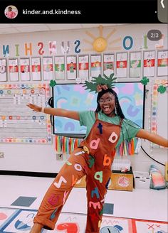 a woman in an orange jumpsuit with letters on it