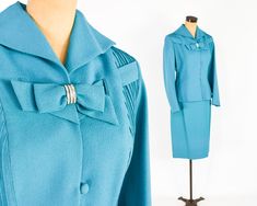 "~ 1950s Gorgeous turquoise blue wool crepe suit ~ This beautiful suit was my Mother's and only worn a few times. ~ Remembering Mom fondly as I'm finally ready to let the suit go ~ Matching decorative bow with rhinestones ~ Both front sides have sewn down pleats ~ Interesting collar & fitted waist ~ 4 covered buttons ~ Jacket has blue silk crepe lining ~ Skirt is half lined in taffeta ~ 7\" side metal zipper ~ Excellent Label: Lilli Ann, Luxurious Fabric of Paris, Loomed in Paris Jacket Bust Fitted Vintage Blue Suits, Vintage Fitted Blue Suits, Blue Fitted Vintage Suit, Fitted Vintage Single Button Blazer, Vintage Blue Single Breasted Outerwear, Blue Vintage Blazer With Lapel Collar, Blue Vintage Blouse With Button Closure, Vintage Blue Blazer With Button Closure, Layered Ruffle Dress