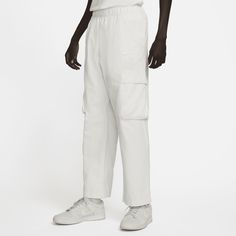 Rooted in the origins of our iconic Air technology, these pants embrace the same commitment to comfort that sets Nike Air apart. The woven cotton fabric is washed for softness and comfort that keeps you cool. Designed with some extra room through the seat and thighs, they also offer an elastic and drawstring waistband for easy entry and removal. And did we mention storage? Hand pockets pair with 2 side utility pockets, so you have plenty of space to store your things on the go. Nike Tracksuit, Man Weave, Pants Cargo, Tracksuit Set, Pocket Bag, Mens Activewear, Woven Cotton, Leather Patches, White Nikes