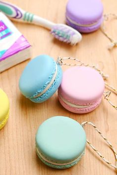 macaroons are sitting on a table next to a toothbrush