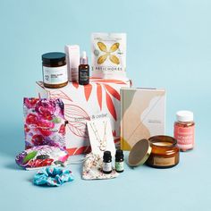 an assortment of skin care products on a blue background