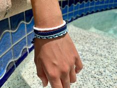 "A combination of four handmade bracelets curated for ocean lovers. Set includes: 1 fishtail braided bracelet, 1 square knotted bracelet, 1 strand bracelet, 1 beaded bracelet Colors of handmade inspired bracelet set :  Marine Blue, Sky Blue, White   📏 Sizing: Bracelets are adjustable to fit wrists 6.5\" to 8.5\" These surfer bracelets can be worn with everything and in every season. Durable and waterproof. Please note: Colours may look different depending on your monitor. Thank you for supporti Casual Blue Braided Bracelet For Vacation, Casual Blue Braided Bracelets For Vacation, Blue Braided Bracelet With Sliding Knot For Summer, Blue Friendship Braided Bracelets, Blue Braided Friendship Bracelets, Everyday Hand Wrapped Blue Friendship Bracelets, Blue Braided Bracelets For The Beach, Blue Braided Bracelet With Sliding Knot For Beach, Blue Hand Wrapped Braided Bracelet For Beach