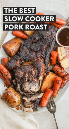 the best slow cooker pork roast with carrots and potatoes on a white plate