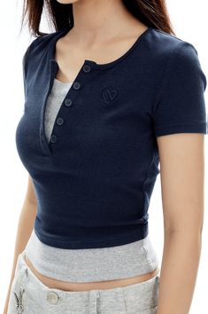 Revamp your everyday look with the allure of the Ribbed Henley Mock Two-Piece Short Sleeve Crop Top. This piece is a seamless fusion of sophistication and understated *style, crafted from a quality blend of 48% cotton and 52% synthetic fibers, including a touch of spandex for that flawless fitted silhouette. The V-neckline and ribbed texture add a classic touch, while the mock two-piece design offers a trendy, layered appearance without the bulk. Elevate your casual repertoire by pairing it with Henley Tank Top Outfit, Henley Top Outfit, Crop Top Layering, Crop Top Style, Grunge Accessories, Simple Wardrobe, Understated Style, Short Sleeve Crop Top, Tank Top Outfits