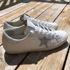 100% Authentic! Gorgeous Swarovski Crystal Superstar Sneaker! Golden Goose Size 41. White Leather Shoe With Silver Swarovski Crystal Star. So Beautiful!!! No Flaws! Very Gently Used!! Euc! No Low Ball Offers Pls! Feel Free To Message Me In A Bundle :) Does Not Come With Original Box But Will Be In A Box. Shoes Golden Goose, White Leather Shoes, Goose Shoes, Golden Goose Shoes, Crystal Stars, Golden Goose, Golden Goose Sneaker, So Beautiful, In A Box