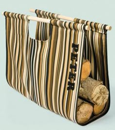 a bag that has logs in it and is hanging from the side with two handles