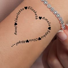 a woman's arm with the words i love you and hearts on it