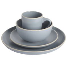 three cups and two saucers sitting on top of each other