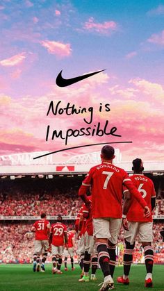 two soccer players in red and white uniforms with the words nothing is impossible above them