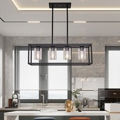 a modern kitchen with an island and bar stools