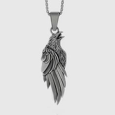 "Viking Raven Necklace Crow Pendant Pagan Odin Norse Nordic Mother's Day Gift, Bird Lover Memorial Gift Sterling Silver ✦ Jewelry Details ✦ * Material: 925 Sterling Silver * Pendant's Dimensions: 41x14mm * Weight: 13-14 grams * Finish: Oxidized, Polished, Gold, Rose Gold * Stamp: 925 * Bail: 4mm * Ideal for daily use with an oxidized finish on 925 sterling silver, which makes details more attractive eye-catching! * It can be made in 10K - 14K - 18K white/rose/yellow gold as well. Contact me! ✦ S Nordic Necklace, Pagan Quotes, Crow Pendant, Crow Necklace, Raven Jewelry, Viking Raven, Raven Pendant, Raven Necklace, Attractive Eyes