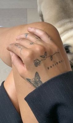 a woman's arm with tattoos on it