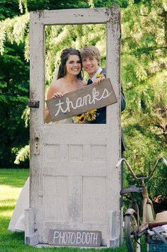 an old door is decorated with a couple's photo and the words thanks on it