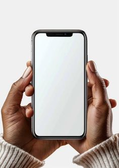 two hands holding an iphone in front of a white background with the screen partially open