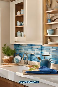 a kitchen with blue and white tiles on the backsplash, cabinets and counter tops