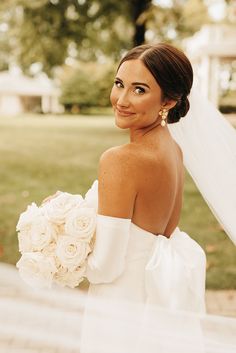 Sleek Full Bridal Updo with White and Gold Earrings with all White Bridal Bouquet and Satin Gloves Low Bun Bridal Hair, Bride Bun, All White Bridal Bouquet, Classic White Wedding, Bride Details, Bride Updo, Satin Gloves