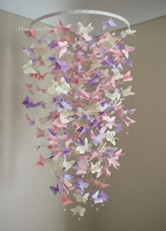 a bunch of butterflies hanging from the ceiling