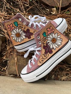 Hand tooled floral design on quality 4-5 oz vegetable tanned leather. Hand sewn. These are the high top Chuck Taylor All Star platform shoes in the Muave color, size 6.5. *All shoe sales are final. Keds Shoes High Tops, Converse Shoes Platform Tan, Painted Keds, High Top Chucks, Leather Converse, Custom Leather Work, Western Shoes, Preppy Shoes, Custom Converse