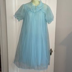 Vintage 60s Helen Of Troy Light Blue Nylon Robe & Nightgown Set With Floral Embroidered Necklines Small Excellent Vintage Condition Looks Like It Was Hardly Worn Robe Armpit To Armpit Is 21” Length Is 43” Nightgown Armpit To Armpit Is 21” Length Is 40” Just Gorgeous Cottage Core Blue Sheer Sleep Dresses, Sheer Blue Sleep Dresses, Sheer Blue Nightgown For Bedtime, Sheer Blue Sleepwear For Spring, Blue Sleepwear For Wedding Night In Spring, Vintage Light Blue Nightgown For Spring, Vintage Sheer Sleepwear For Sleepover, Vintage Blue Dress For Sleepover, Vintage Light Blue Summer Nightgown