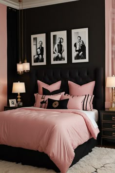 a black and pink bedroom with pictures on the wall above the bed, along with two nightstands