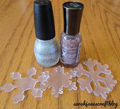 nail polish and snowflakes on a table