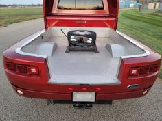 the back end of a red pickup truck