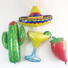 three inflatable balloons, one with a margarita and the other with a strawberry