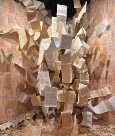 an art installation made out of newspaper strips