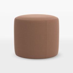 a round ottoman with a brown cover on it