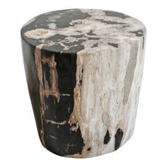 a black and white wooden stool with peeling paint