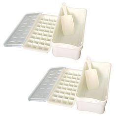 two plastic trays with spatulas on them