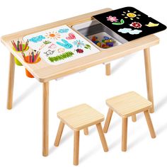 a child's wooden table with two stools and an easel on it