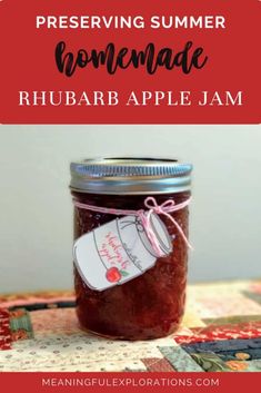 a jar filled with homemade rhubar apple jam sitting on top of a table