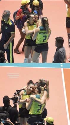 the women's tennis team is hugging each other in front of their cameramen