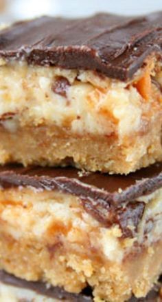 three pieces of chocolate and coconut bars stacked on top of each other