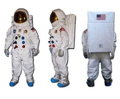 three astronauts in white spacesuits standing next to each other with an american flag on the back