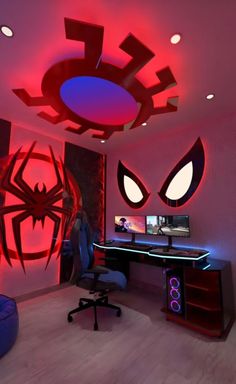 a computer desk with spider man decals on the wall