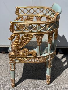 an ornately decorated chair sitting on the ground