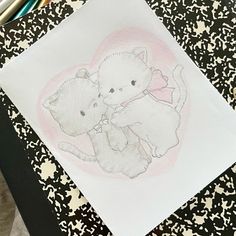 a drawing of two bears hugging on top of a piece of paper with colored pencils next to it