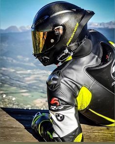 a person wearing a motorcycle helmet and protective gear