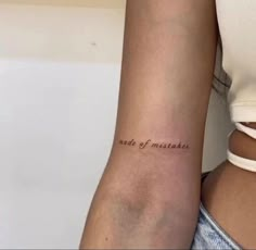 a woman's arm with a tattoo that says, made of mistakes on it