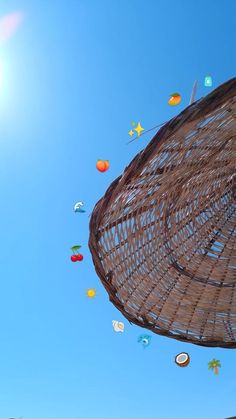 many different colored kites are flying in the sky