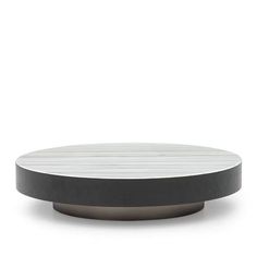 a white and black round table on a white background