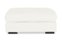 a white couch with black legs on a white background